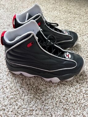 Jordan Kids Black and White High-Top Athletic Shoes with Red Accents - Size 5